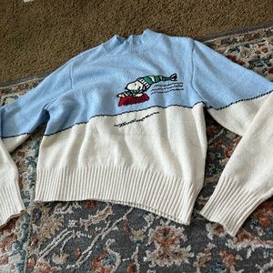 Snoopy sledding sweater